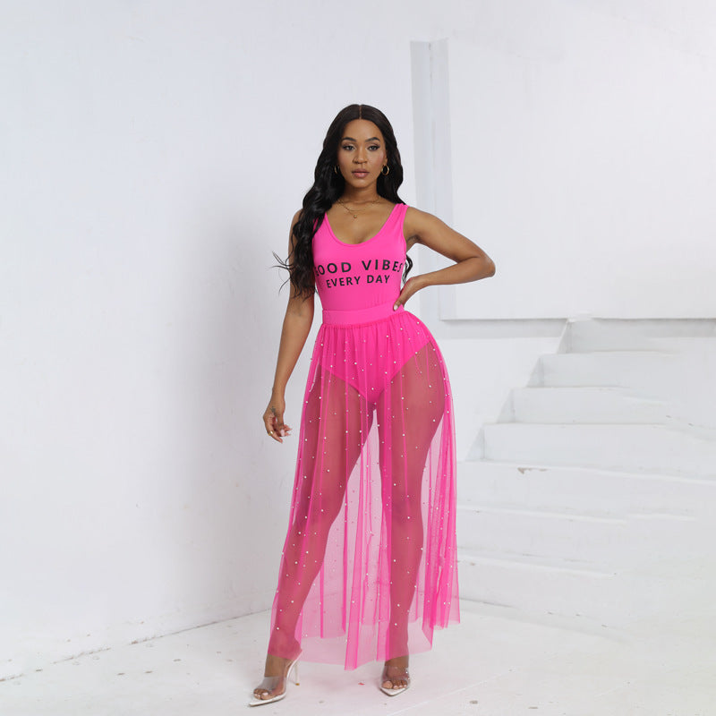 Pink sleeveless summer dress with sparkly beaded bust and sheer skirt