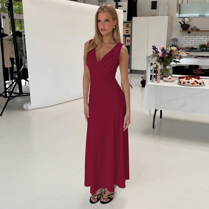 Burgundy sleeveless midi dress with V-neck, fitted bodice, and flowing skirt