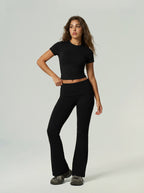 Black short-sleeve sports top and high-waist flared leggings set