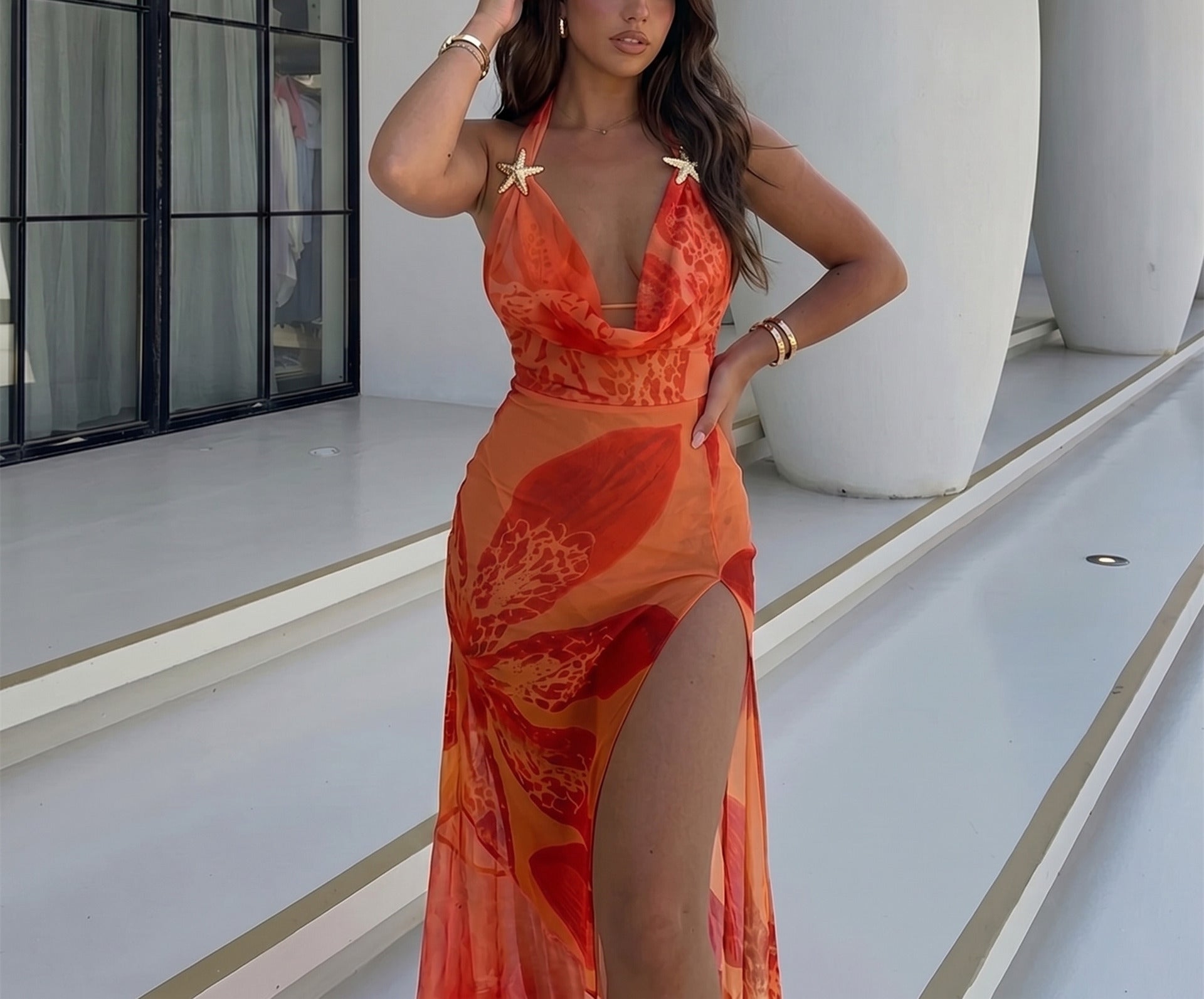 Orange lace maxi dress with thin straps, V-neck and layered sheer skirt