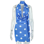 Blue polka dot backless sheath dress on mannequin, halter tie at neck
