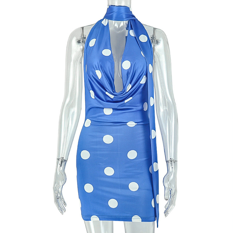 Blue polka dot backless sheath dress on mannequin, halter tie at neck