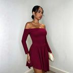 Burgundy long-sleeve off-shoulder dress with gathered waist and flowing pleated hem