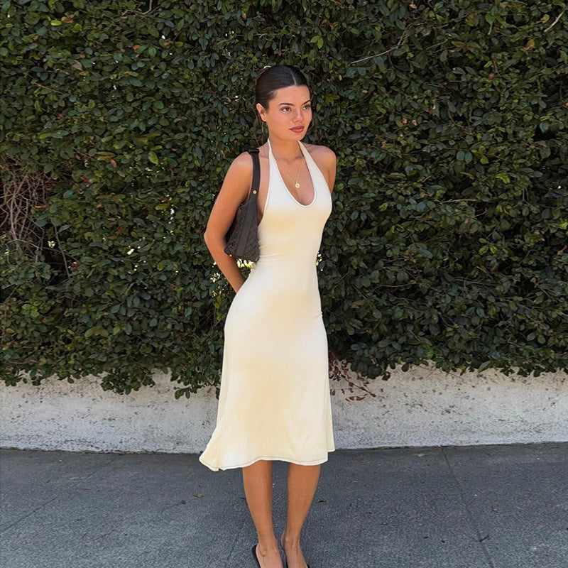 Apricot halter midi dress with scoop neckline and softly gathered skirt
