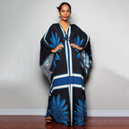 One-piece beach swim dress with V-neck, draped sleeves, and navy floral grid pattern