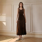Brown velvet sleeveless dress with pleated hem and round neckline