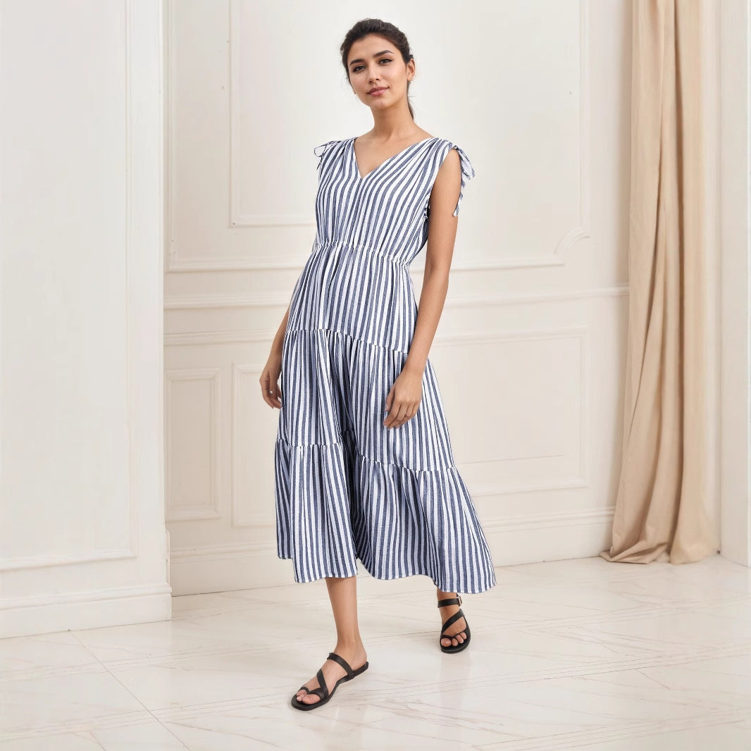 Blue-and-white striped sleeveless dress with tiered skirt, V-neck, gathered shoulder