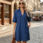 Light blue collared half dress with short sleeves, front button placket