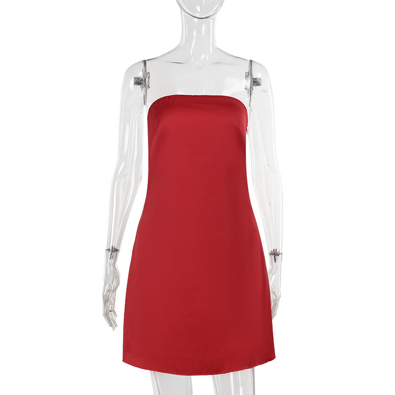 Red satin slip dress with thin straps and straight, fitted silhouette