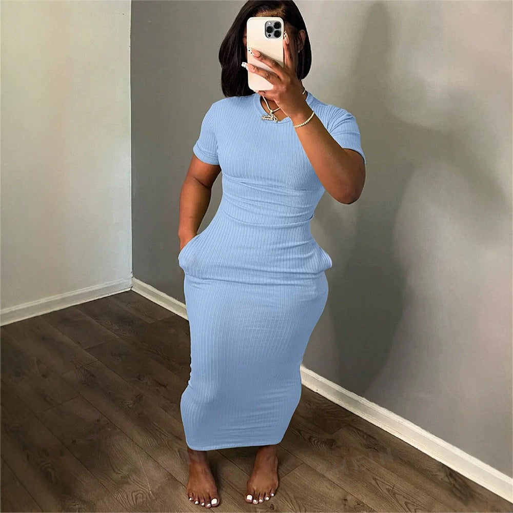 Light blue ribbed knit short-sleeve midi dress, fitted silhouette, crew neck.