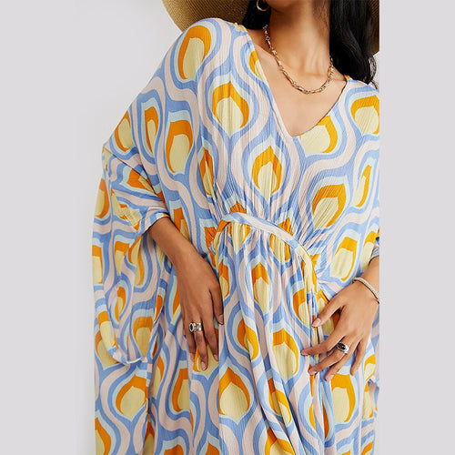 Blue and yellow patterned beach dress cover-up close-up, V-neck with gathered waist