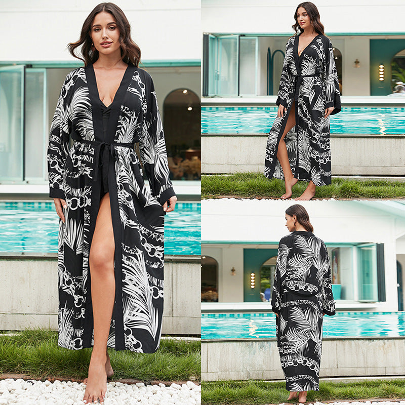 Mid-length rayon beach cover-up shirt, black with white ornate leaf print, tie waist