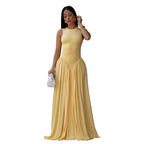 Yellow sleeveless maxi dress with high neck and pleated gathered skirt