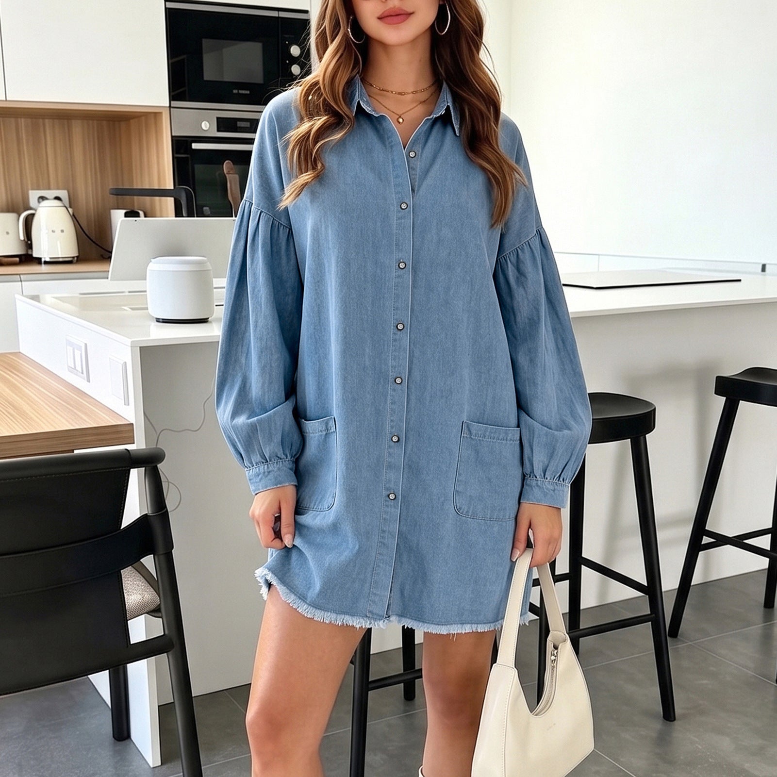 Light blue denim long-sleeve shirt dress with button front, chest pocket, gathered cuffs