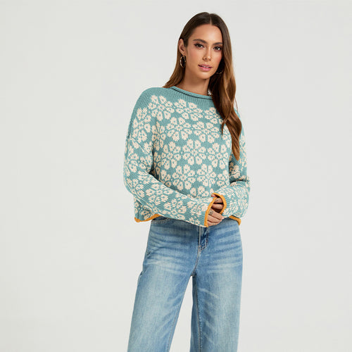 Women's round-neck knit sweater, mint blue with cream daisy jacquard pattern.