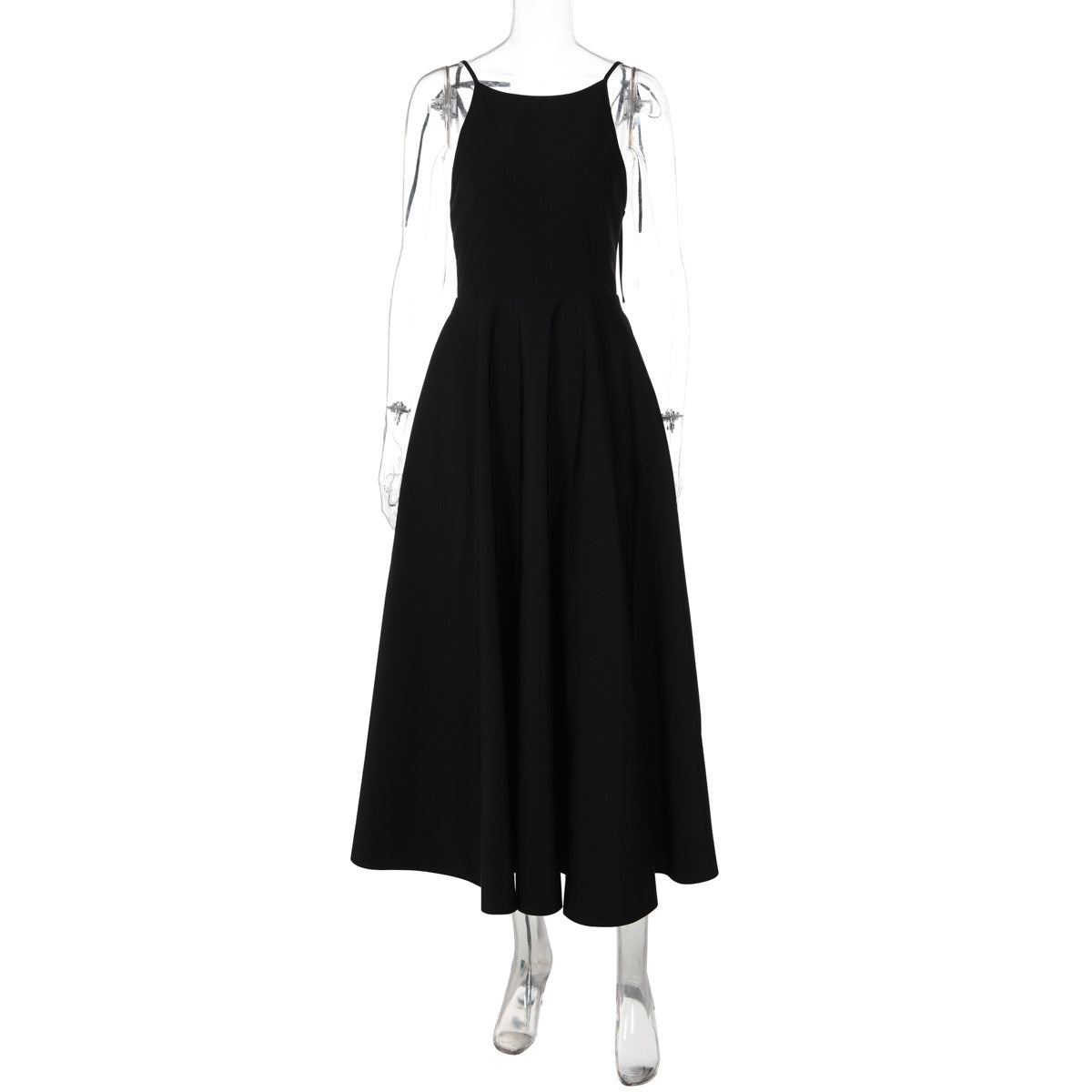 Black backless cami dress on mannequin, flared midi skirt and thin tie straps