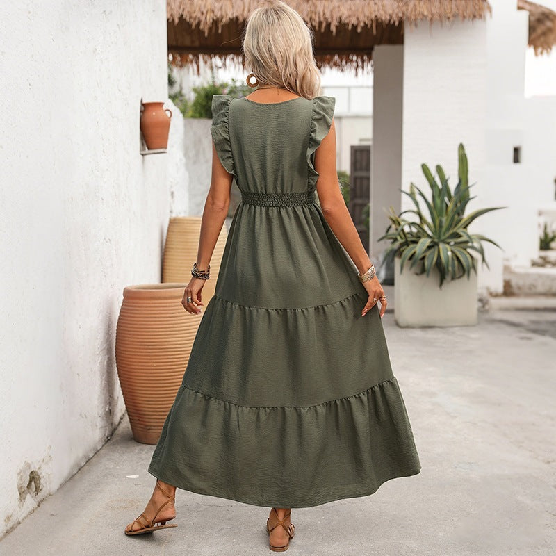 Olive-green sleeveless tiered ruffle dress shown from the back with waist belt