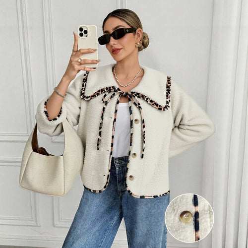 Beige fleece jacket with leopard-spotted trim, doll collar, and bow-tie lace-up front
