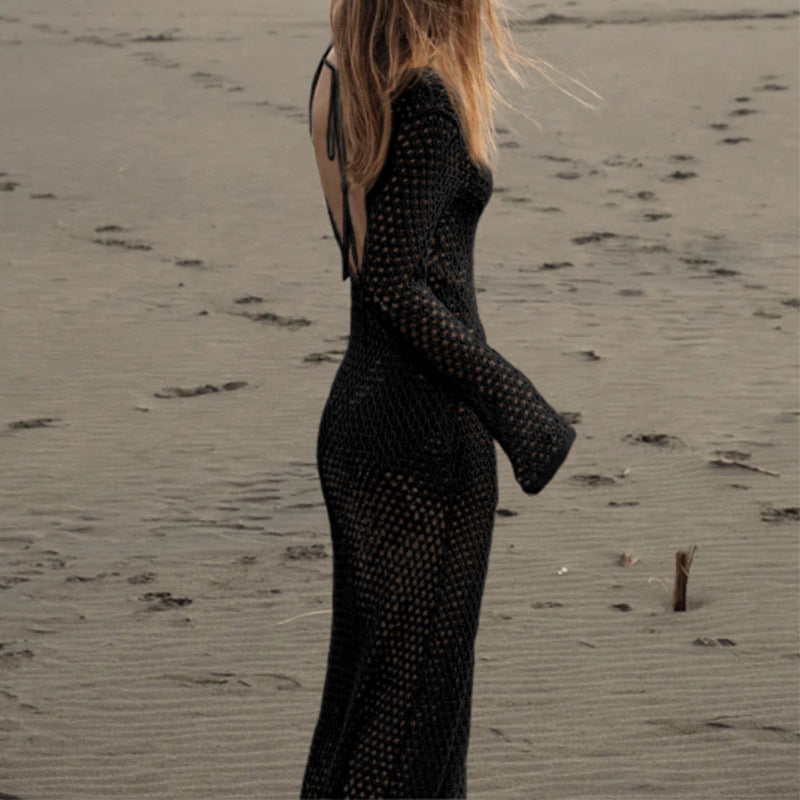 Black hollow-out knit V-neck maxi dress with ring buckle, long sleeves, side profile