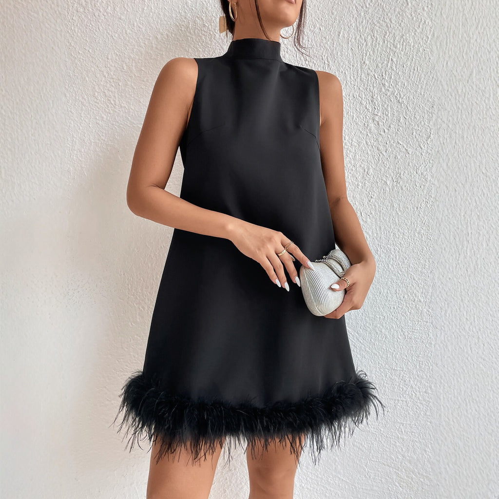 Black sleeveless half-turtleneck dress with feather-trim frayed A-line hem