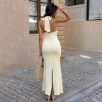 Cream backless halter maxi dress with low open back and floor-length hem