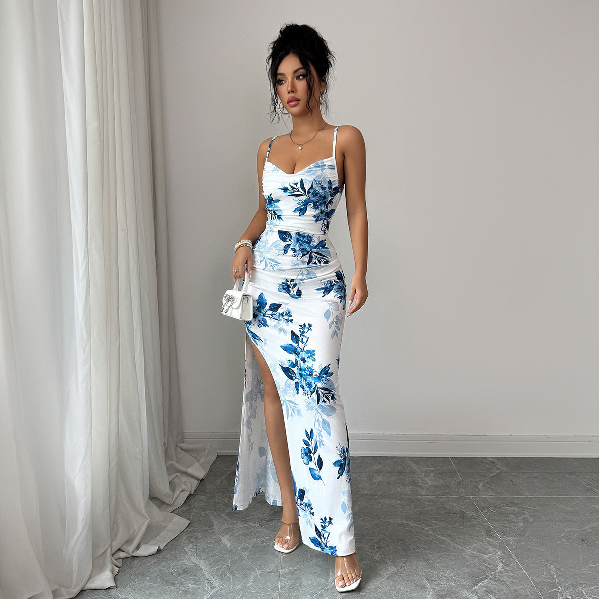 Maxi sling dress in white with blue floral print, ruched waist, front slit