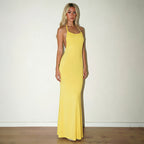 Yellow backless maxi dress with thin spaghetti straps and scoop front.