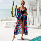 Printed beach jacket cardigan with colorful blue and pink patterns, tied waist kimono style