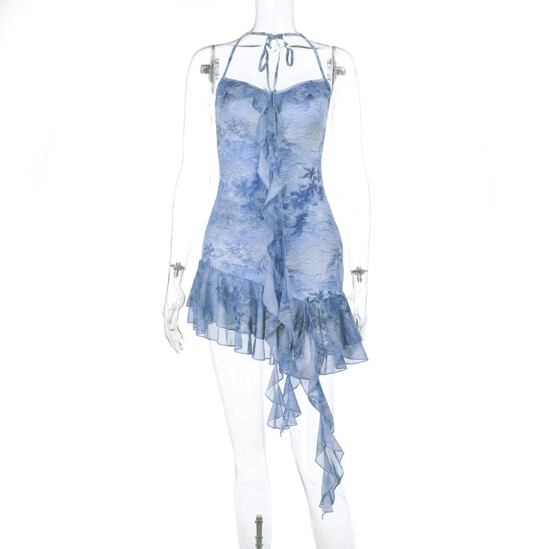 Blue halter mini dress on mannequin with backless draped straps and ruffled asymmetric hem