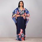 One-piece beach dress in navy with pink and orange floral print and wide sleeves