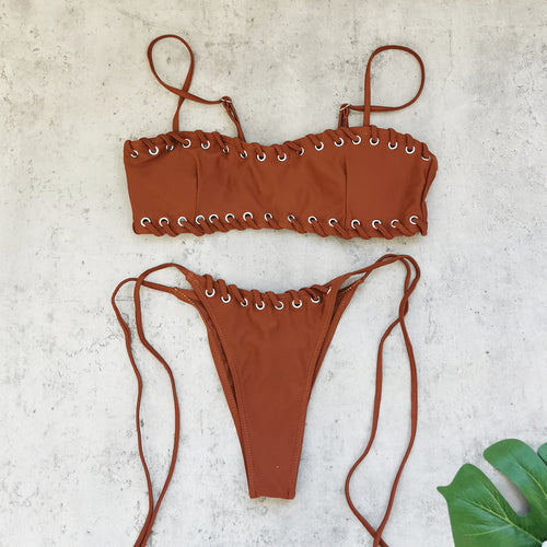 Brown bandeau cover-up set laid flat: bandeau top and high-cut string tie bikini bottom
