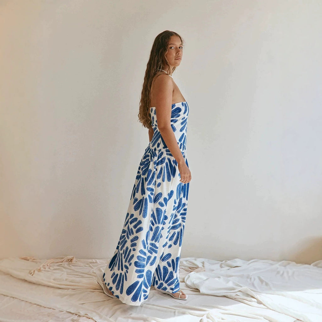 Strapless maxi dress with blue abstract floral tie-dye print, sleeveless bodice