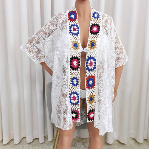 White beach cover-up tunic with lace texture and colorful embroidered V-front trim