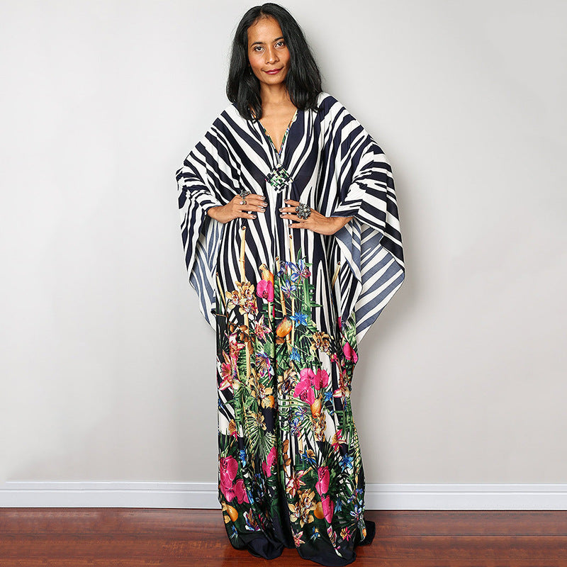 One-piece beach dress with black-and-white zebra stripes and colorful floral lower panel