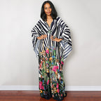 One-piece beach dress with black-and-white zebra stripes and colorful floral lower panel