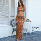 Women’s lace halter dress in orange floral print, draped bust and fitted midi length.