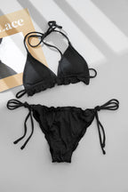 Lace-trim bikini swimwear set, black triangle top and tie-side bottom flat lay