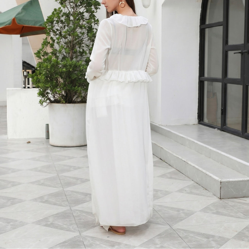 White one-piece swimwear, long sleeves, tiered ruffle front and skirt