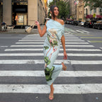 Light blue sheath summer dress with one-shoulder drape and green floral print