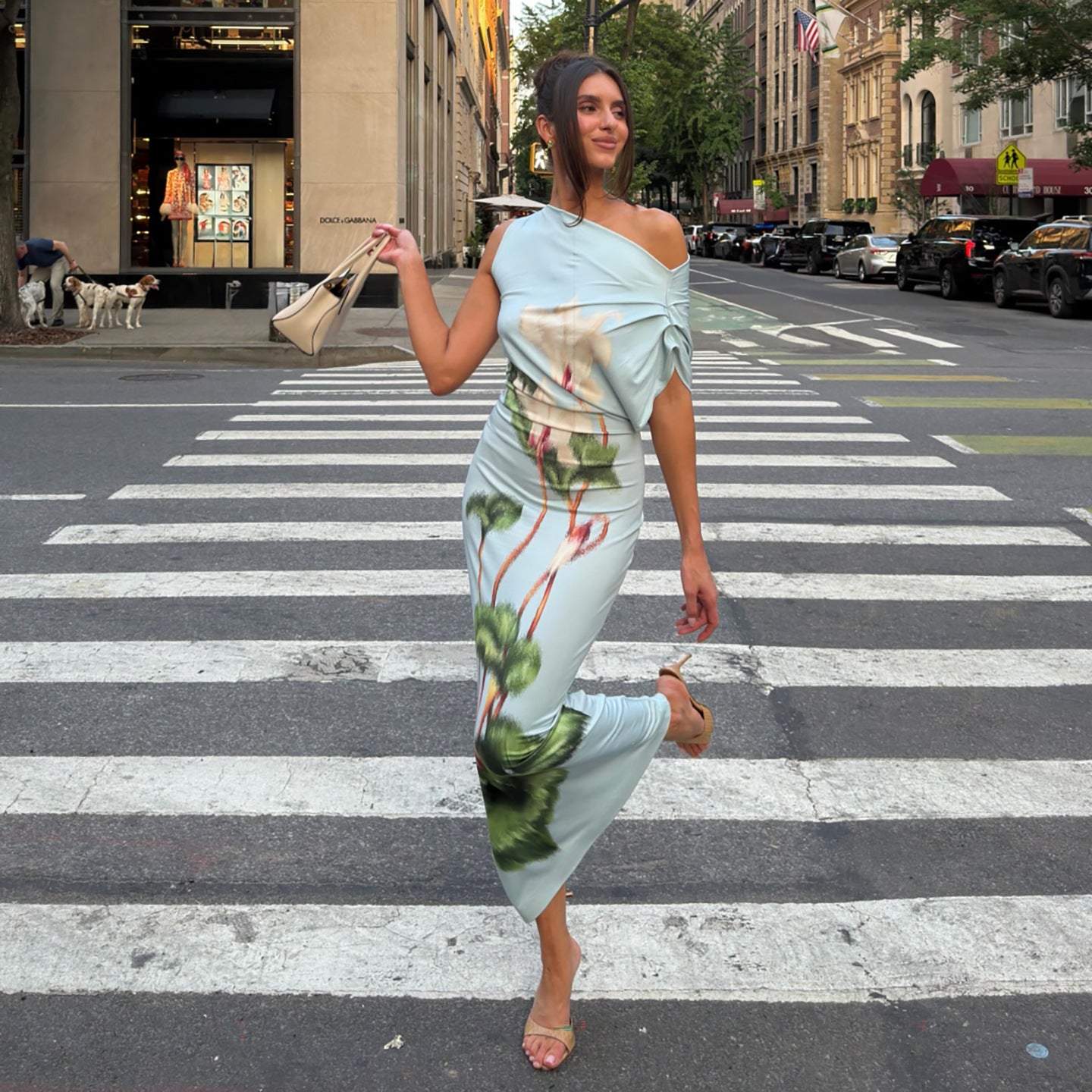 Light blue sheath summer dress with one-shoulder drape and green floral print