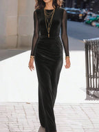 Black velvet maxi dress with long sleeves and smooth body-hugging drape