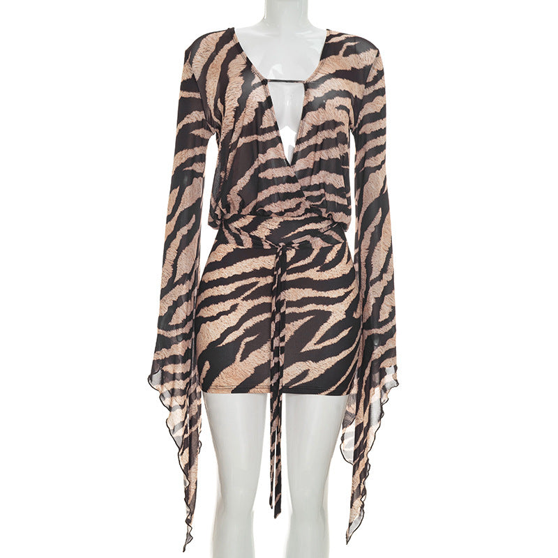 Tiger-stripe sheath dress on mannequin, V-neck front, sheer long sleeves, tie waist
