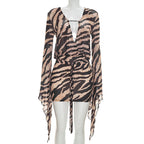 Tiger-stripe sheath dress on mannequin, V-neck front, sheer long sleeves, tie waist