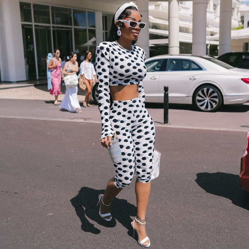 Polka dot two-piece outfit: long-sleeve crop top and capri leggings, white/black