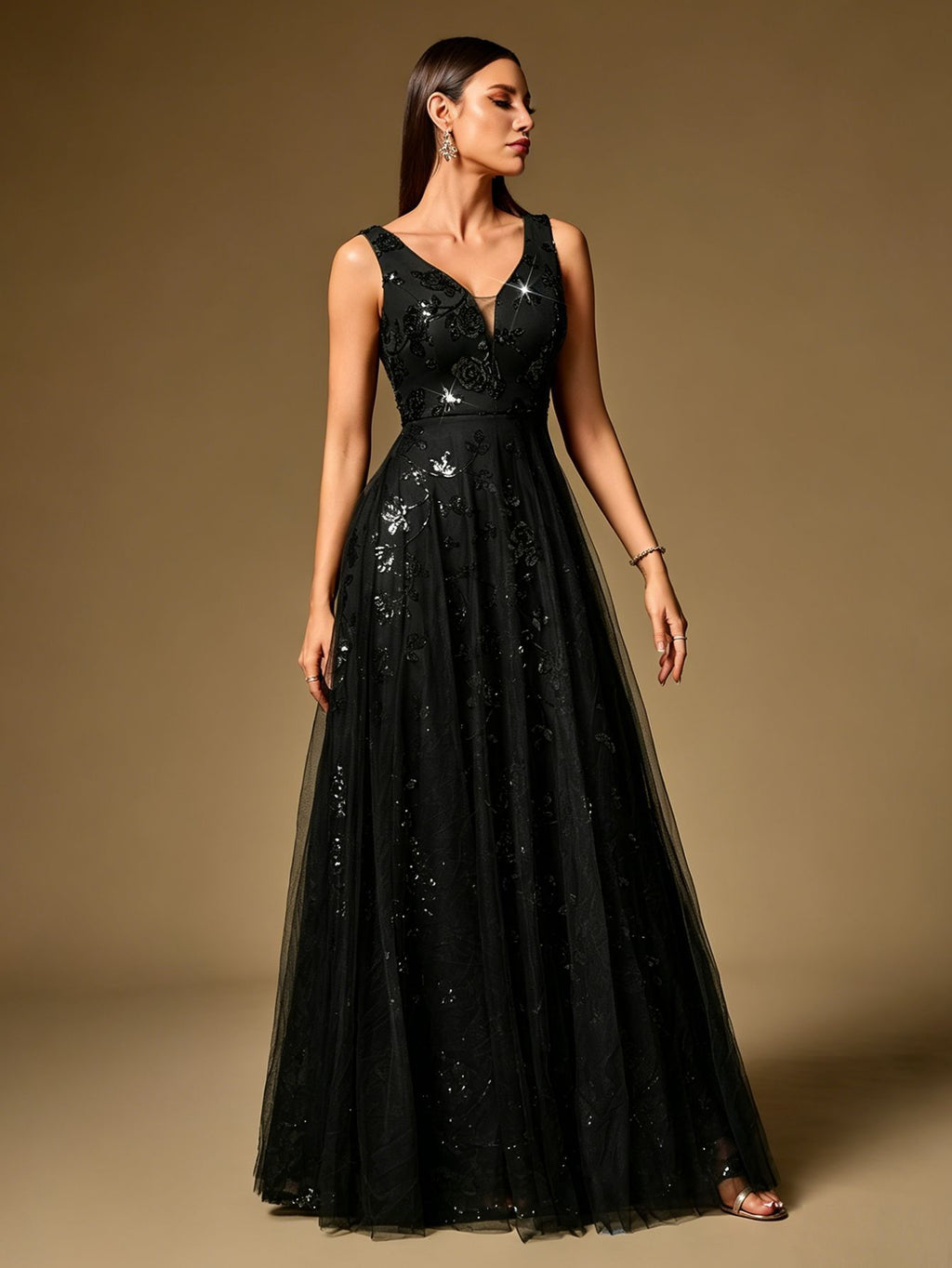 Black sleeveless sequin evening dress with V-neck, fitted bodice, and full tulle skirt.
