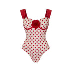 Red polka-dot one-piece swimsuit with sweetheart neckline and red rose applique