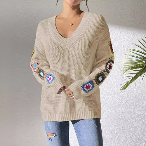 Beige V-neck knit sweater with multicolor floral patches on the sleeves and cuffs
