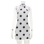 Polka dot satin halter mini dress with sheer long sleeves, black dots on white