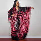 Black with bright pink and red swirl-print one-piece swim dress with V-neck