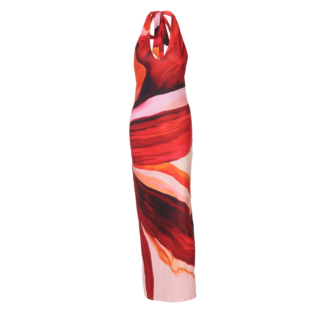 Women’s halter maxi dress in red and orange abstract print with tie neck